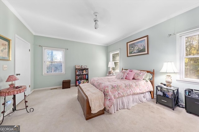 carpeted bedroom with crown molding