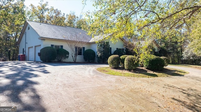 view of side of property with a garage