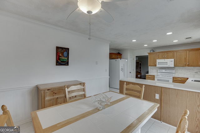 kitchen with backsplash, white appliances, light tile patterned floors, kitchen peninsula, and ceiling fan