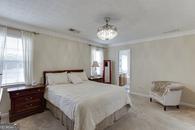 carpeted bedroom with ornamental molding, ensuite bath, a textured ceiling, and a chandelier