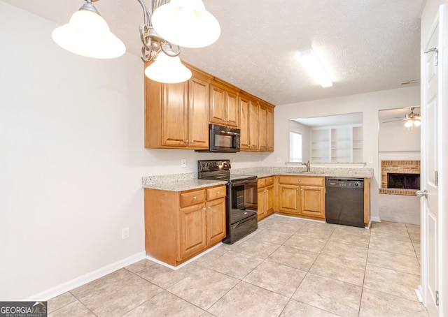 kitchen featuring black appliances, a textured ceiling, ceiling fan, light tile patterned flooring, and decorative light fixtures