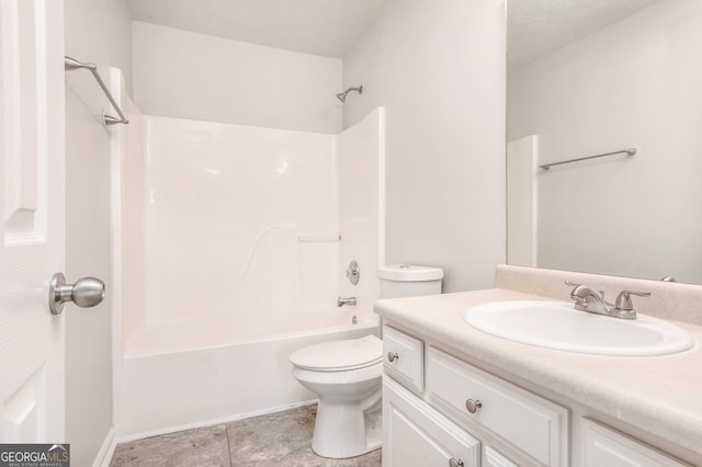 full bathroom with shower / washtub combination, toilet, tile patterned flooring, a textured ceiling, and vanity