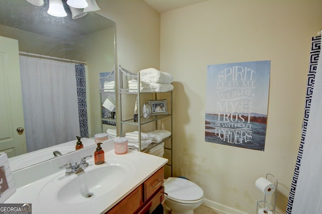 bathroom with vanity and toilet