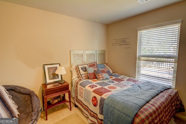 bedroom with light carpet