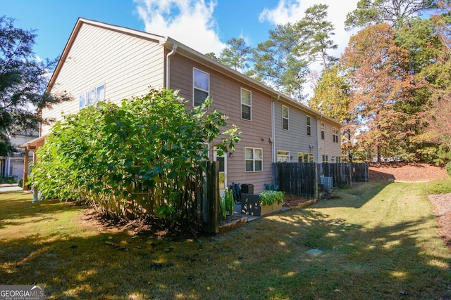 view of home's exterior featuring a yard