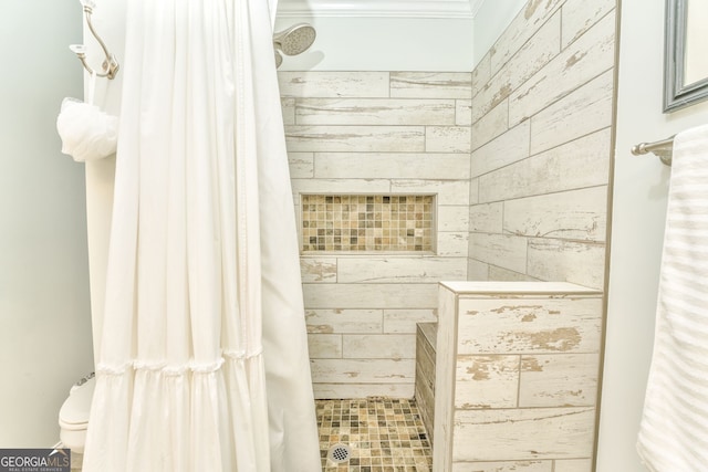 full bathroom with toilet and tiled shower