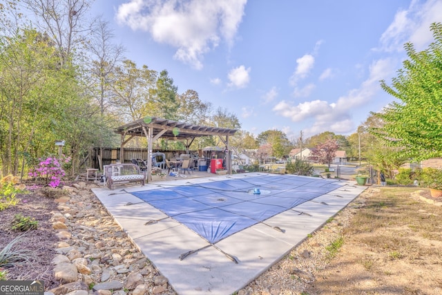 view of swimming pool with a fenced in pool, a patio, fence, and a pergola