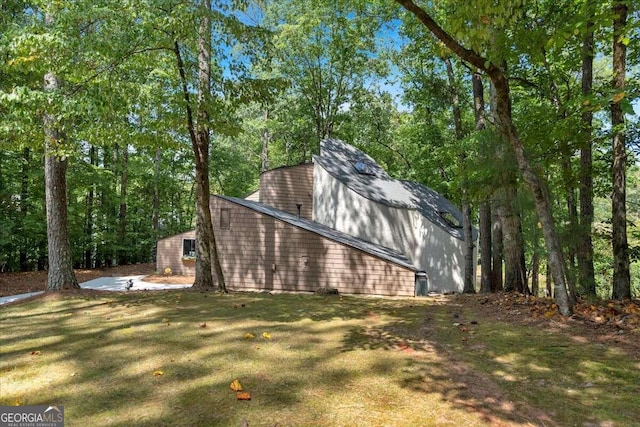 view of home's exterior featuring a lawn