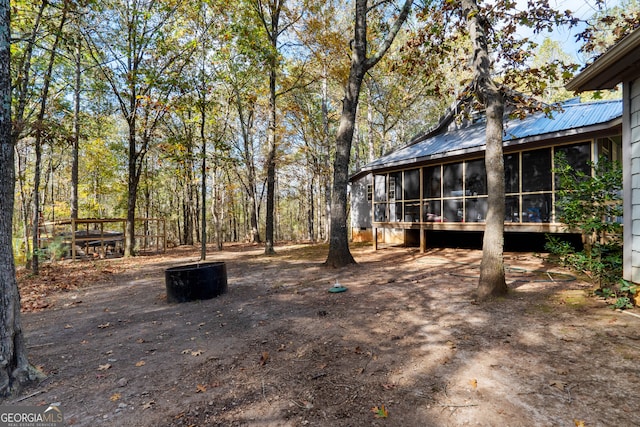 view of yard with a sunroom