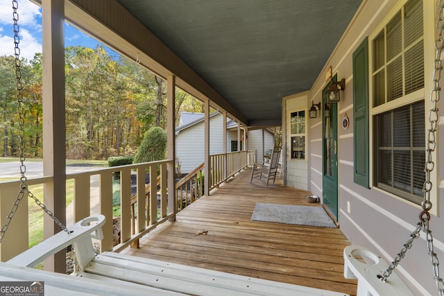 wooden deck featuring covered porch