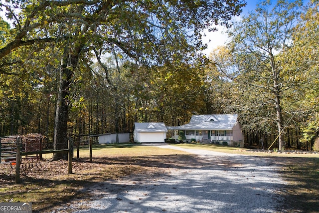 view of front of property with a garage and a porch