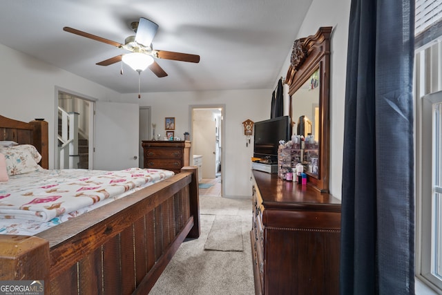 bedroom with light colored carpet and ceiling fan