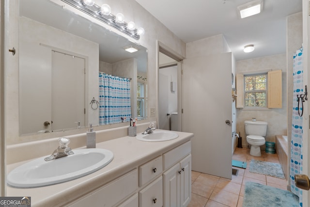 bathroom with toilet, vanity, a shower with shower curtain, and tile patterned flooring