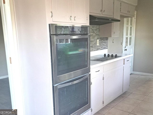 kitchen with backsplash, white cabinetry, black electric stovetop, and light tile patterned flooring