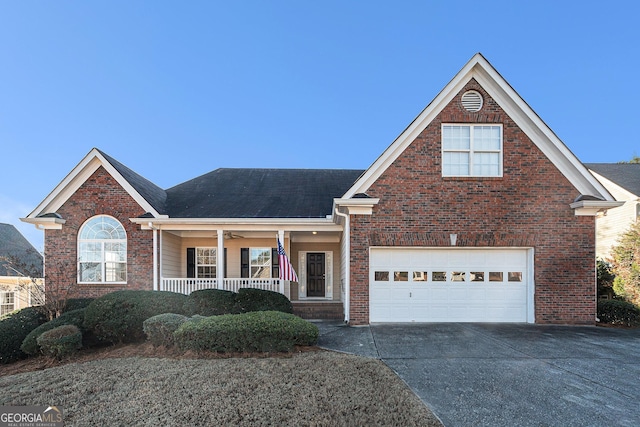 view of property with a porch and a garage