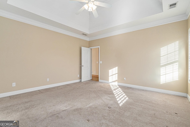 unfurnished room featuring light carpet, plenty of natural light, and ornamental molding