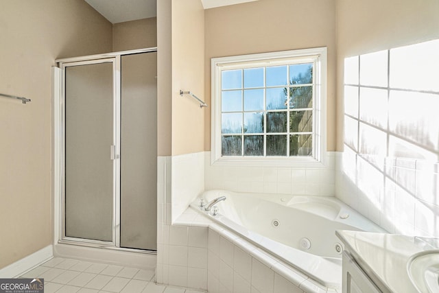 bathroom featuring tile patterned flooring, vanity, and shower with separate bathtub