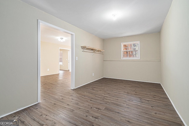 spare room with dark hardwood / wood-style floors