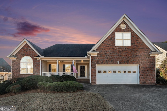 view of front of property with a porch and a garage