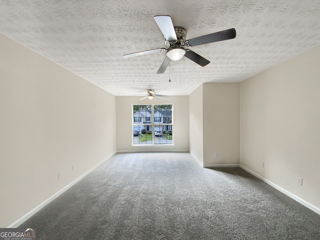 carpeted empty room with a textured ceiling and ceiling fan