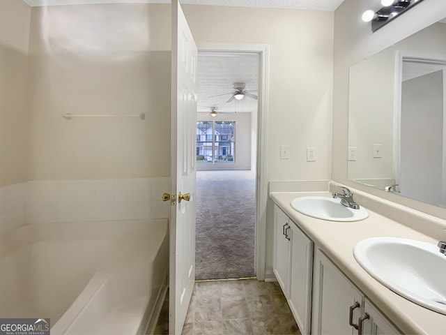 bathroom featuring ceiling fan and vanity