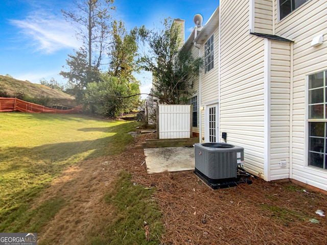 view of yard featuring central air condition unit