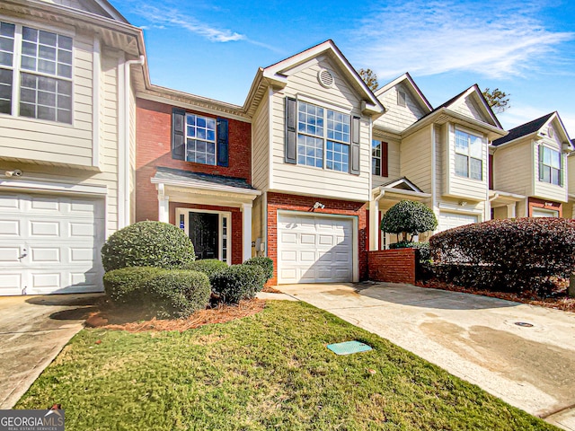 townhome / multi-family property featuring a garage