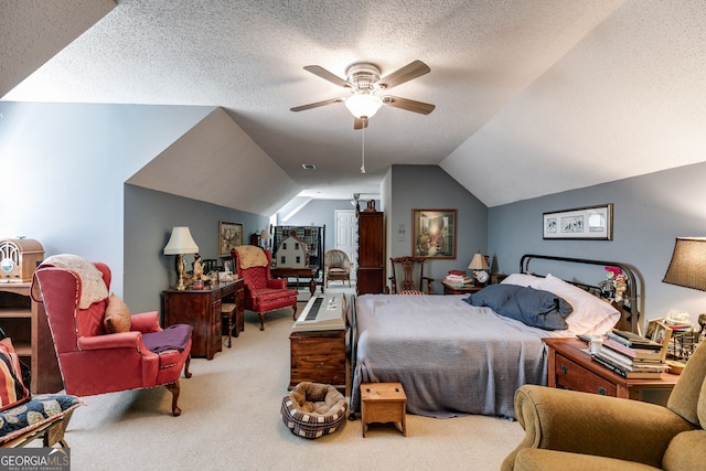 carpeted bedroom featuring a textured ceiling, ceiling fan, and vaulted ceiling