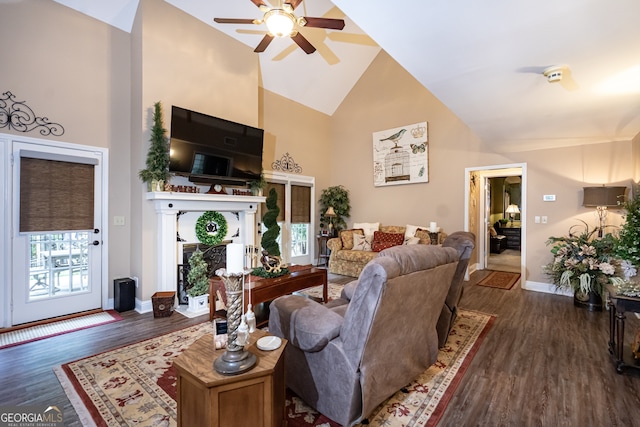 living room featuring high vaulted ceiling, ceiling fan, and dark hardwood / wood-style flooring