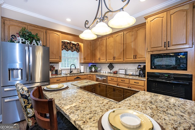 kitchen with light stone counters, ornamental molding, sink, black appliances, and decorative light fixtures