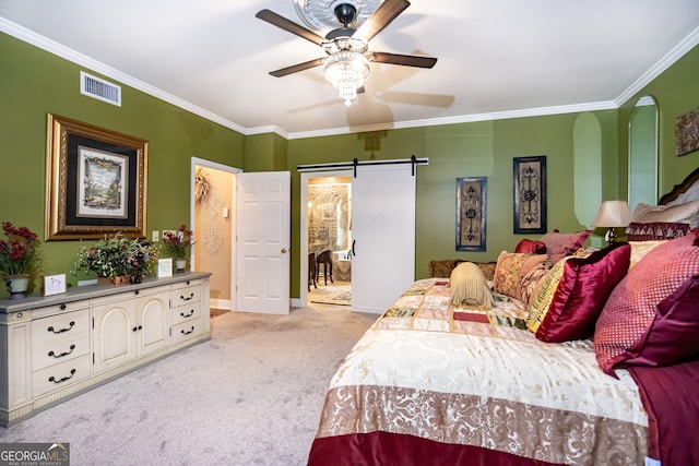 bedroom with light carpet, a barn door, ceiling fan, and ornamental molding