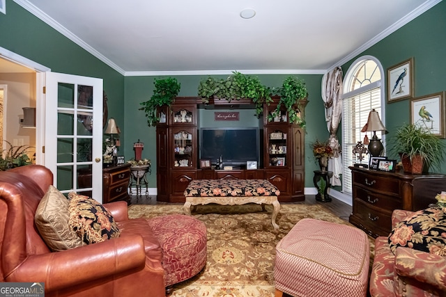 living room featuring hardwood / wood-style floors and crown molding