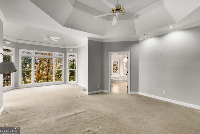 unfurnished living room featuring carpet, ceiling fan, and crown molding