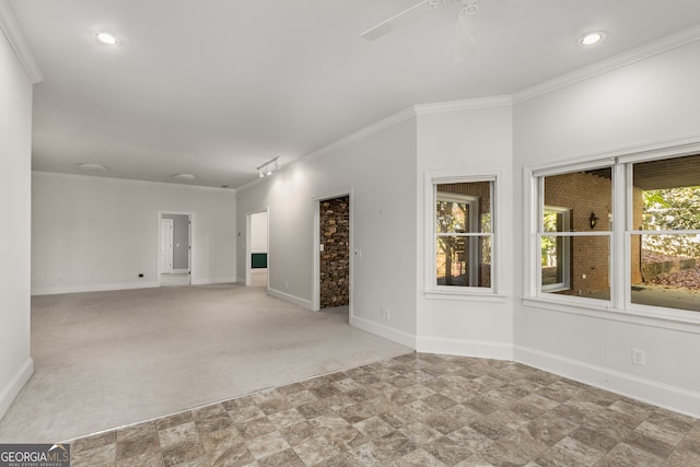 unfurnished living room featuring light colored carpet and ornamental molding