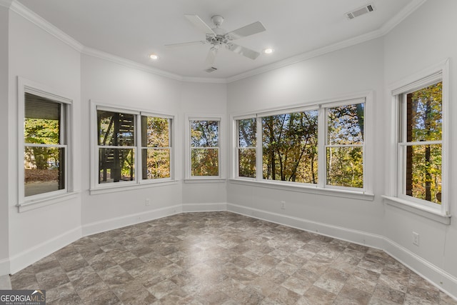 unfurnished sunroom with a wealth of natural light and ceiling fan