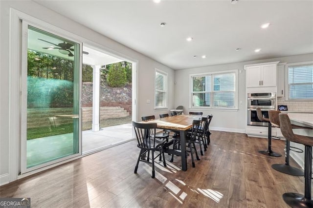 dining space with dark hardwood / wood-style floors