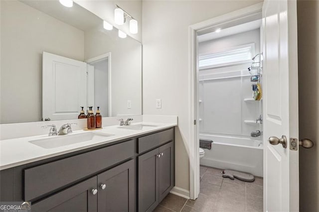 full bathroom featuring toilet, bathing tub / shower combination, vanity, and tile patterned flooring