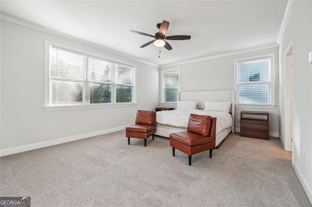 carpeted bedroom featuring ornamental molding and ceiling fan