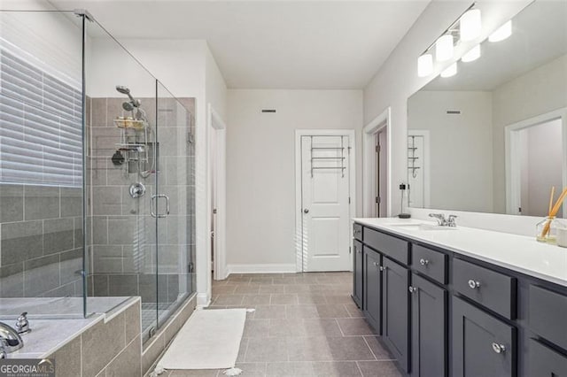 bathroom featuring vanity, tile patterned floors, and separate shower and tub