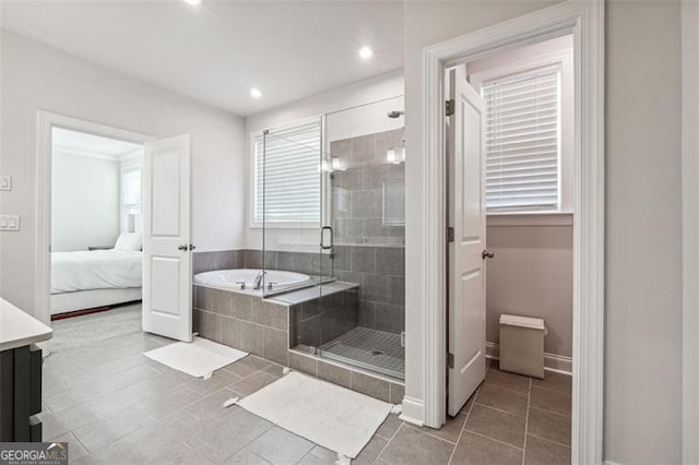 bathroom featuring tile patterned flooring and plus walk in shower