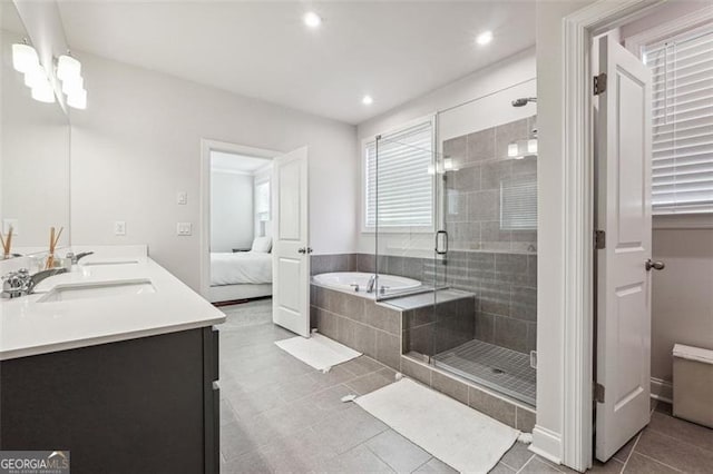 bathroom featuring tile patterned flooring, vanity, and plus walk in shower