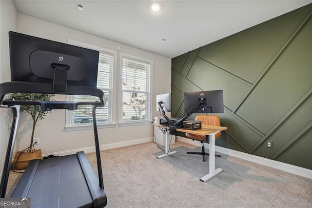 workout area featuring light carpet