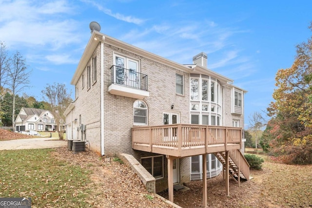 back of house with a wooden deck