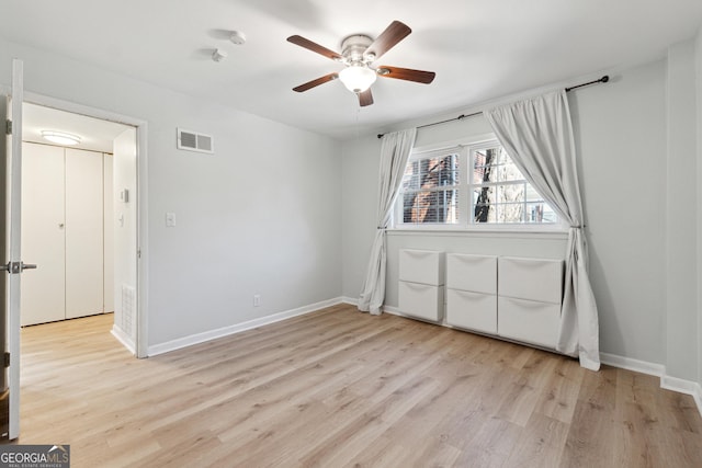 unfurnished bedroom featuring ceiling fan and light hardwood / wood-style flooring