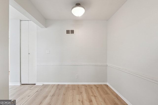 spare room featuring light hardwood / wood-style floors