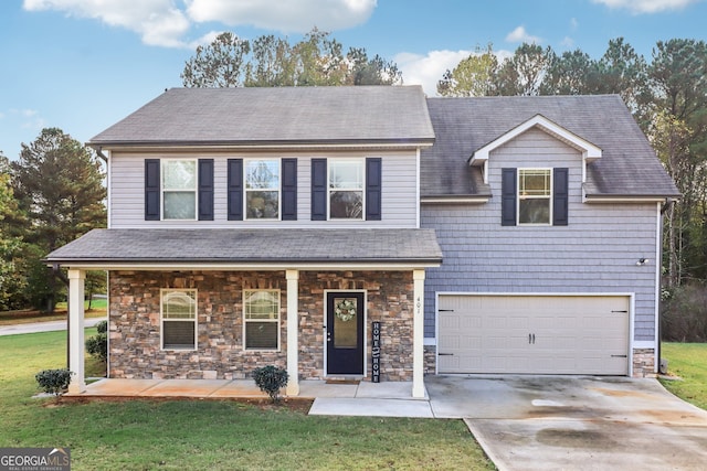 view of front of home with a front yard, a porch, and a garage