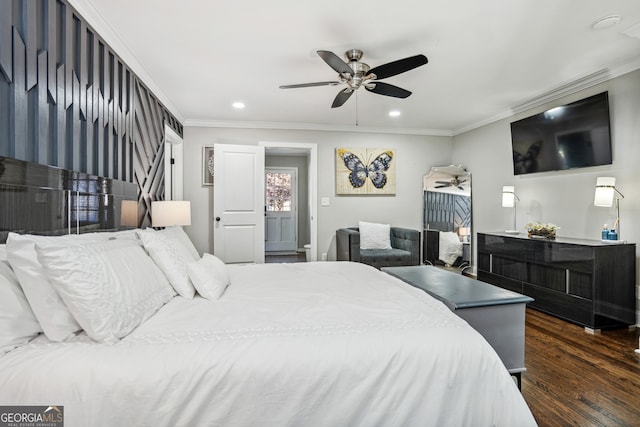 bedroom with dark hardwood / wood-style floors, ceiling fan, and crown molding