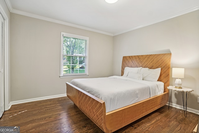 bedroom featuring crown molding and dark wood-type flooring