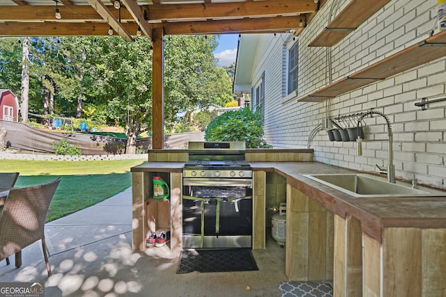 view of patio featuring sink and exterior kitchen