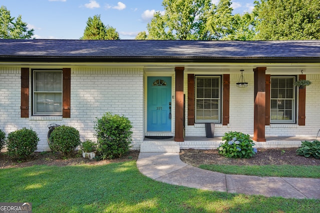 ranch-style house with covered porch